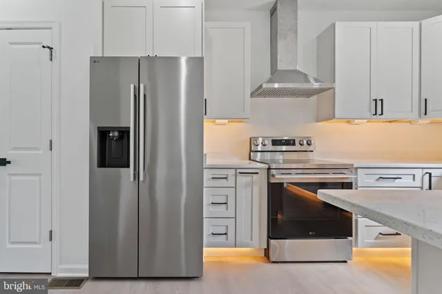 a kitchen with stainless steel appliances sink a microwave and cabinets
