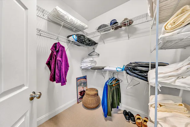a bathroom with a double vanity sink mirror and toilet
