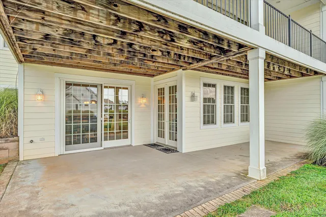 an aerial view of lake and residential houses with outdoor space
