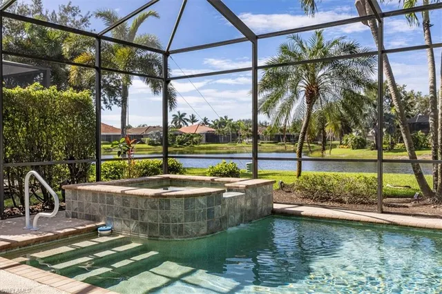 a view of a swimming pool with a patio