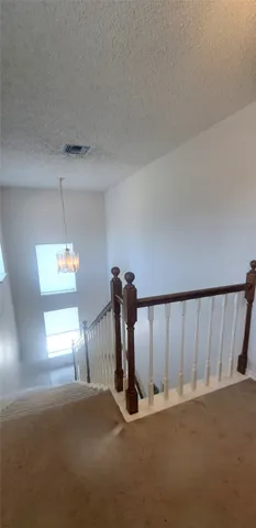 a view of a hallway with a window