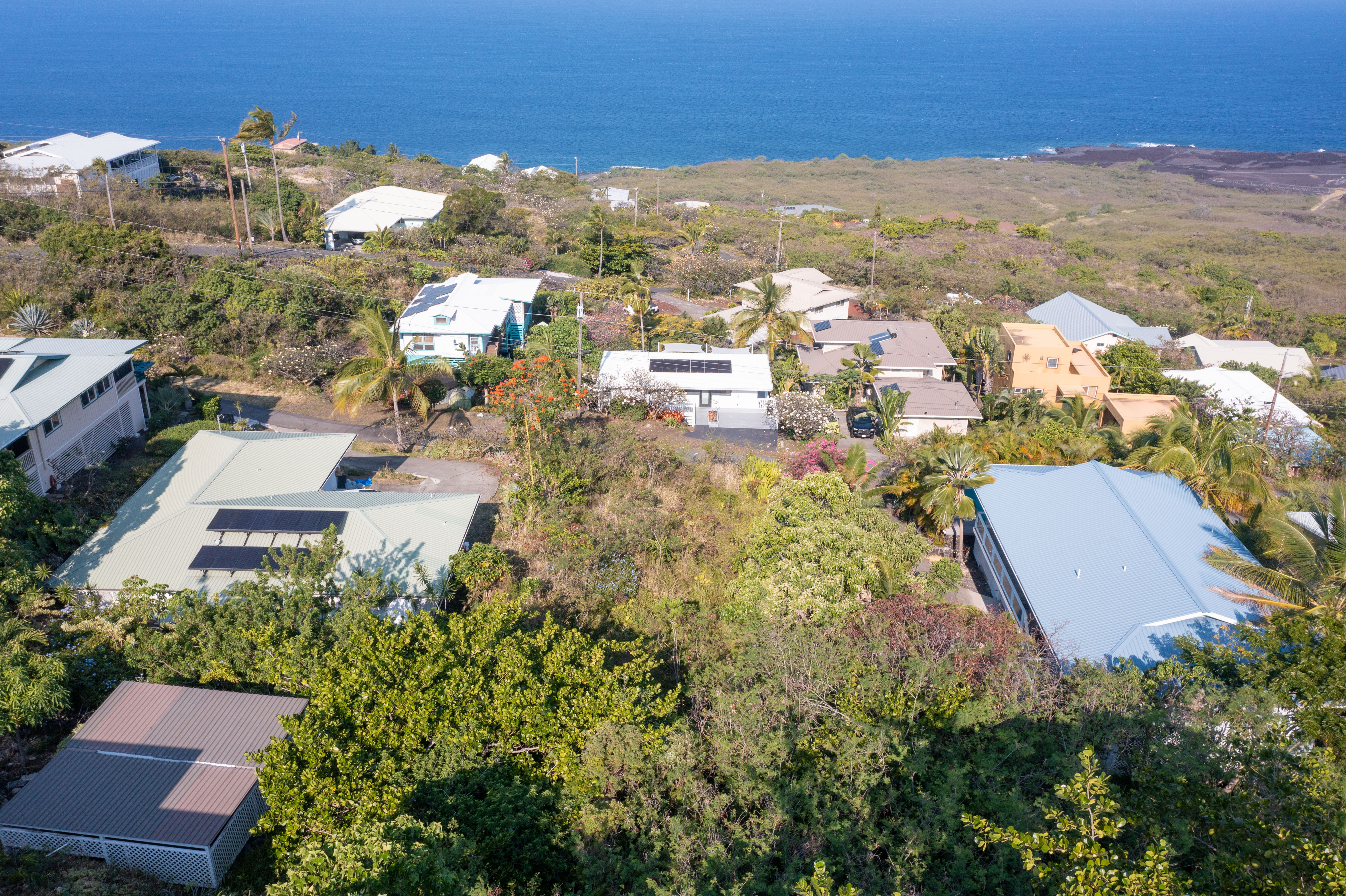 174 Guava Road Captain Cook, HI 96704 - Photo 3 of 16 an aerial view of residential houses with outdoor space