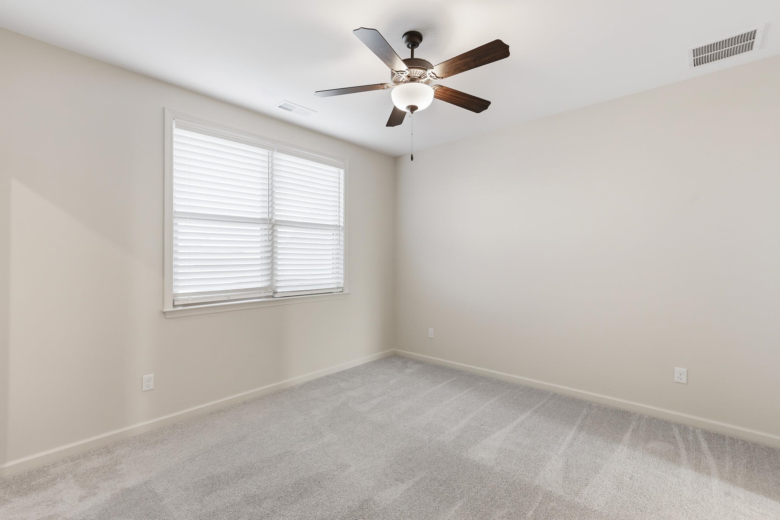 897 Ufton Alley Collierville, TN 38017 - Photo 23 of 32 an empty room with a window and a fan