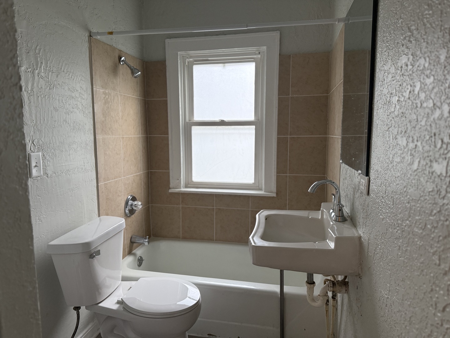 540 South Osborn Avenue Kankakee, IL 60901 - Photo 7 of 11 a bathroom with a sink toilet a mirror and shower