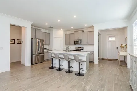 a bedroom with a bed and a potted plant