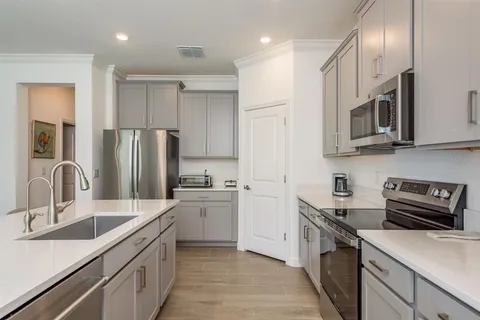a bathroom with a double vanity sink mirror and