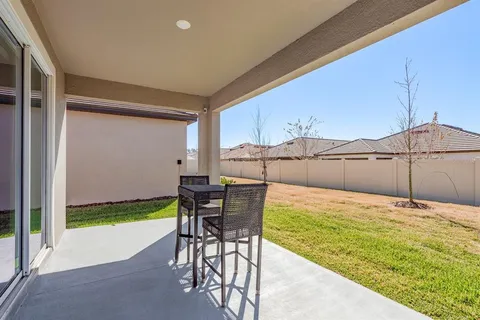 an aerial view of a house with a garden