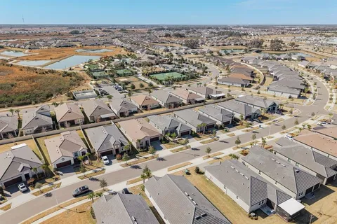 a view of a dining room with furniture and a chandelier