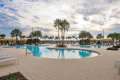 an aerial view of a house with a garden and swimming pool
