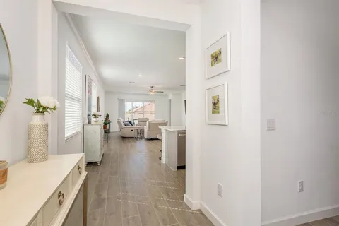 a bed room with furniture and a flat screen tv