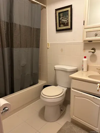 a bathroom with a toilet and a sink