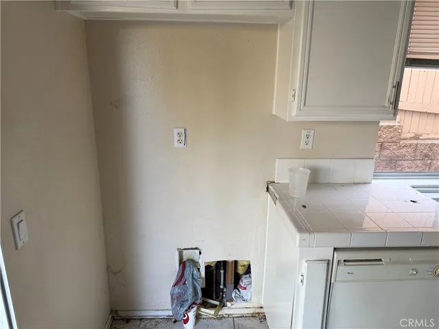 a view of storage and utility room with washer and dryer