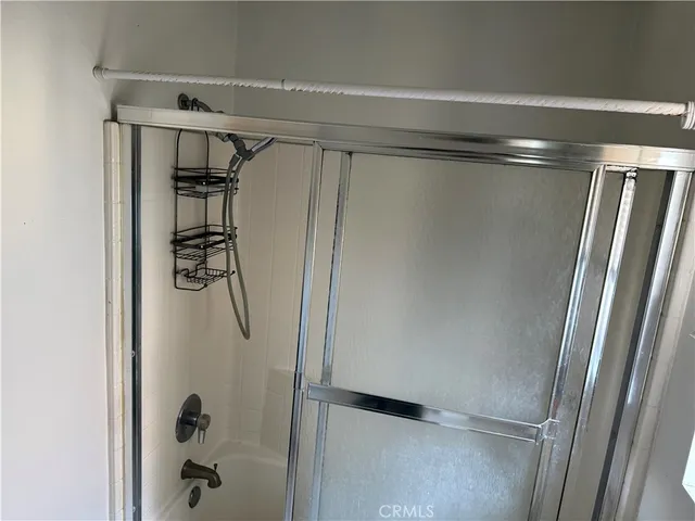 a view of an empty room with windows