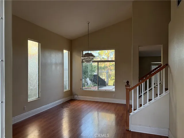 a view of an entryway with wooden floor