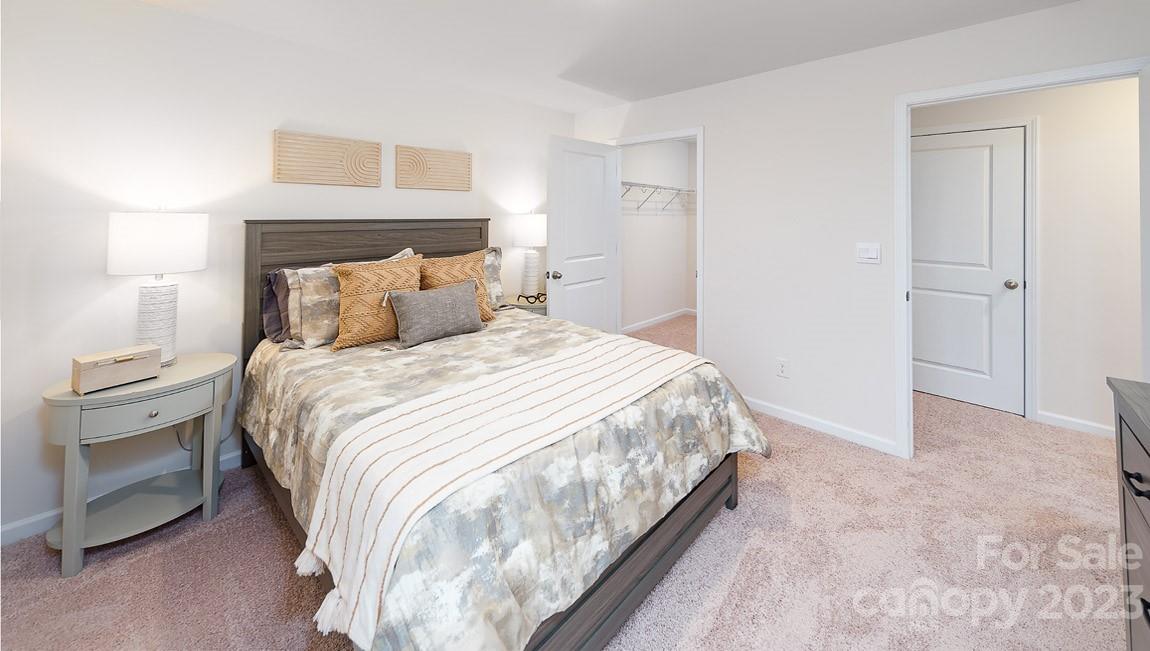 7899 Iron Road Sherrills Ford, NC 28673 - Photo 29 of 41 a bedroom with a bed and a lamp