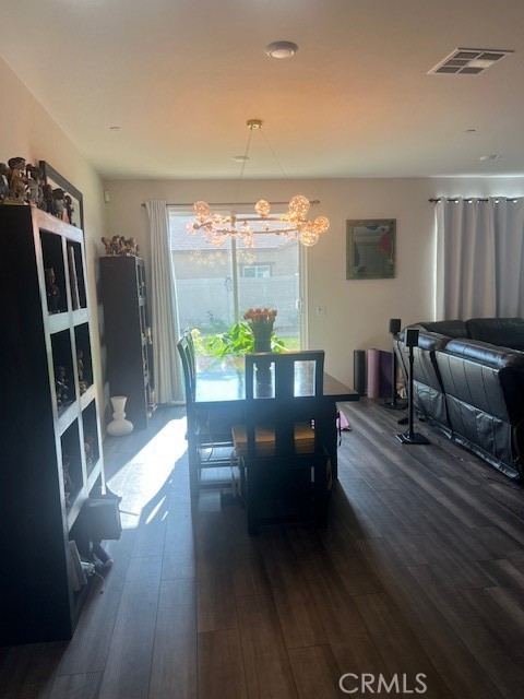 29901 Bridlegate Way Menifee, CA 92584 - Photo 6 of 43 a view of a dining room with furniture window and wooden floor