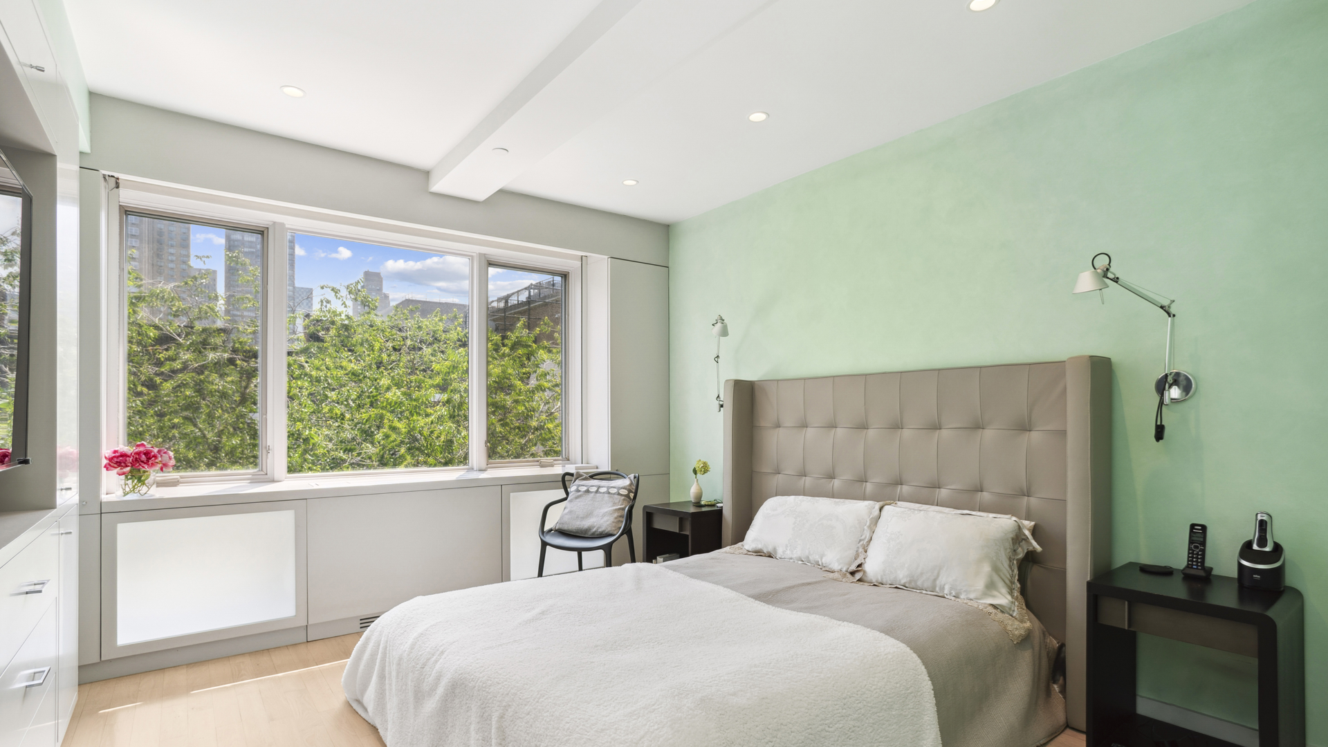 435 East 76th Street, Unit 6A Manhattan, NY 10021 - Photo 6 of 13 a bedroom with a large bed and a window