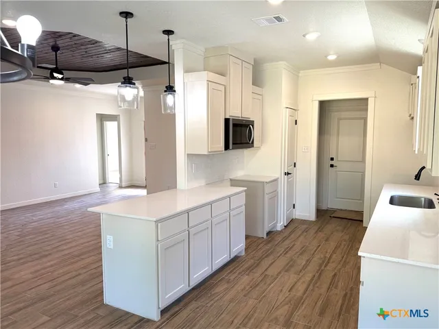 a room with a window and wooden floor