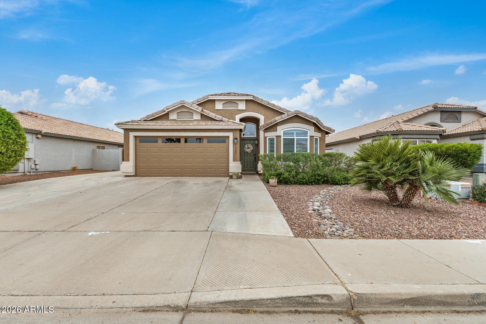 159 West Gail Drive Gilbert, AZ 85233 - Photo 1 of 46 a front view of a house with a yard and garage
