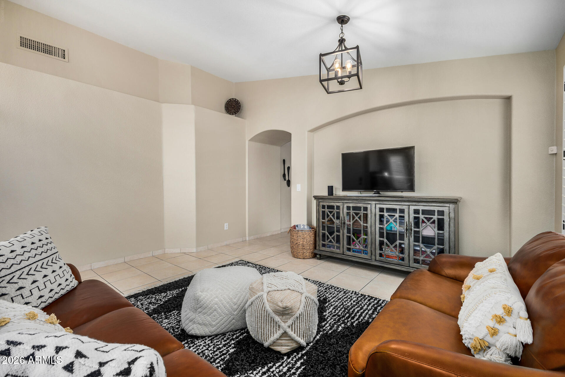 159 West Gail Drive Gilbert, AZ 85233 - Photo 12 of 46 a living room with furniture and a flat screen tv