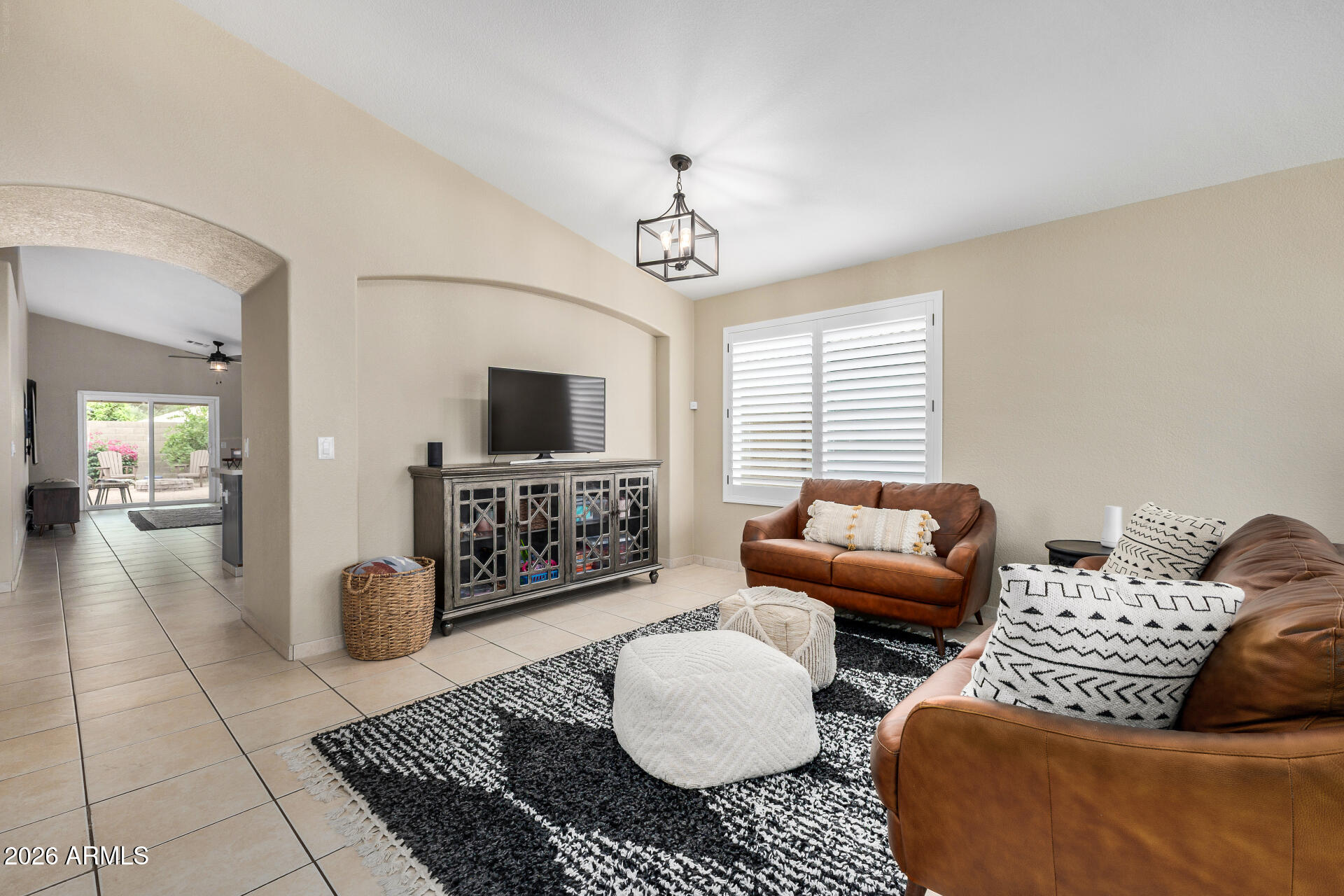 159 West Gail Drive Gilbert, AZ 85233 - Photo 14 of 46 a living room with furniture and a flat screen tv