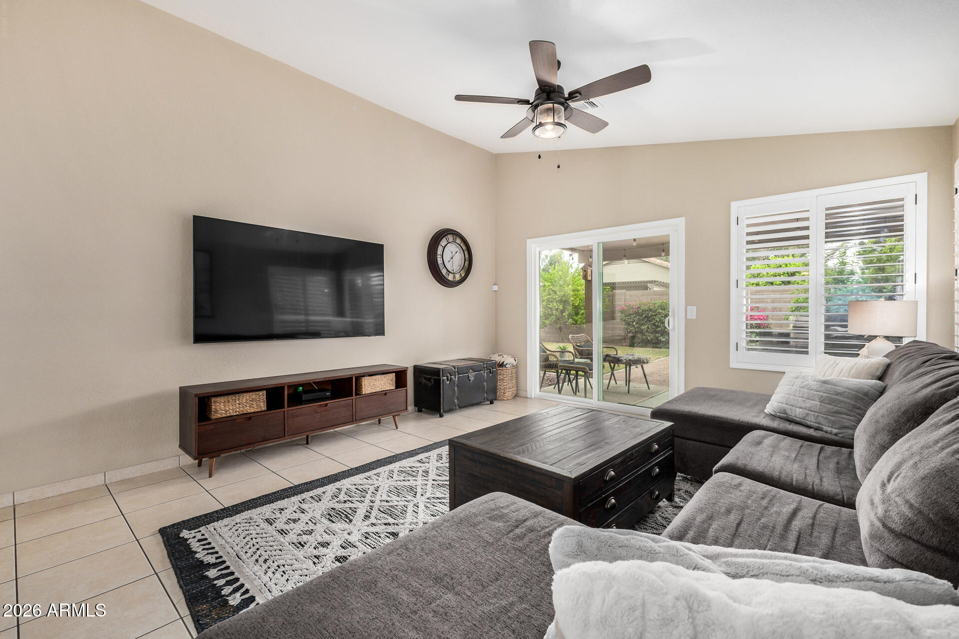 159 West Gail Drive Gilbert, AZ 85233 - Photo 15 of 46 a living room with furniture and a flat screen tv