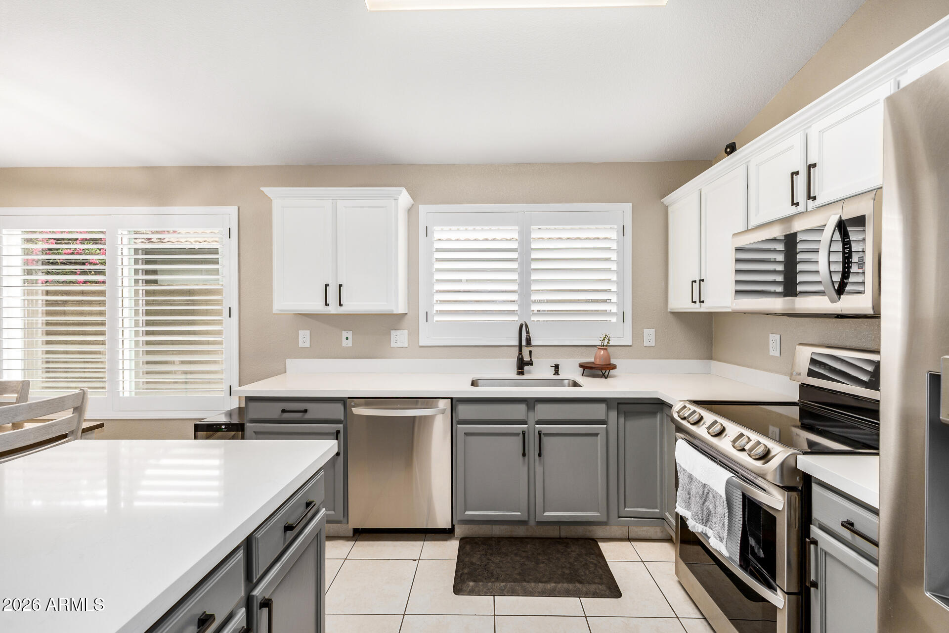 159 West Gail Drive Gilbert, AZ 85233 - Photo 25 of 46 a kitchen with a sink stove top oven and cabinets