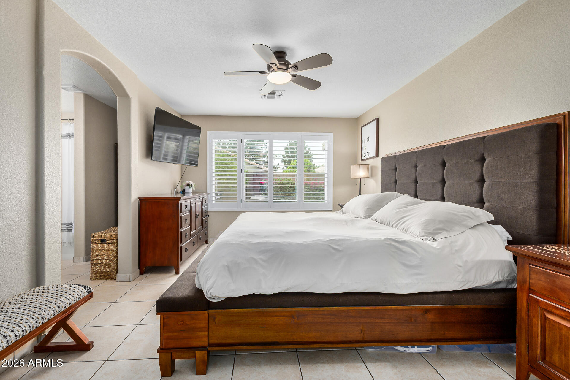 159 West Gail Drive Gilbert, AZ 85233 - Photo 27 of 46 a spacious bedroom with a bed and a table