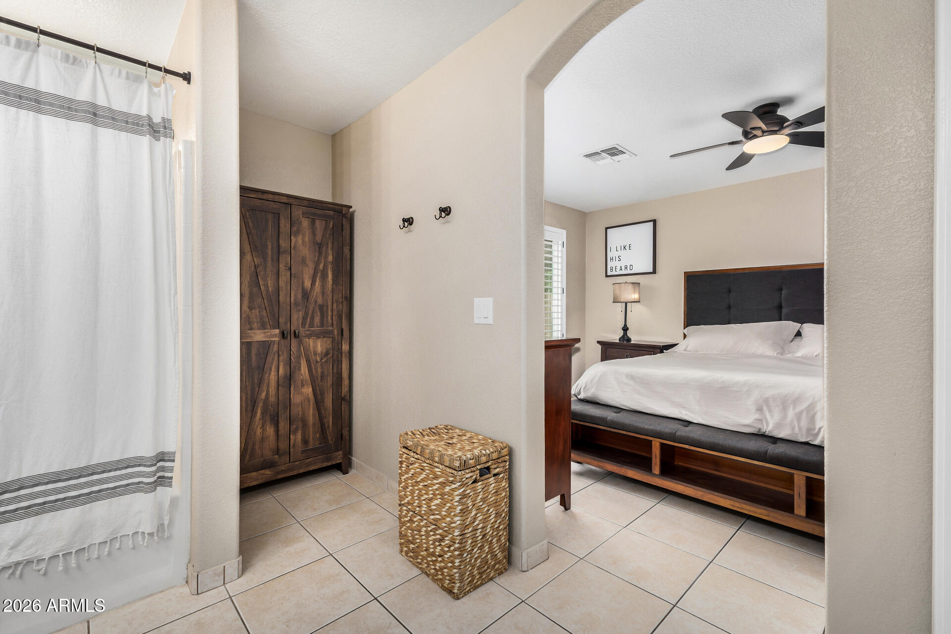 159 West Gail Drive Gilbert, AZ 85233 - Photo 30 of 46 a bedroom with a bed and a chandelier