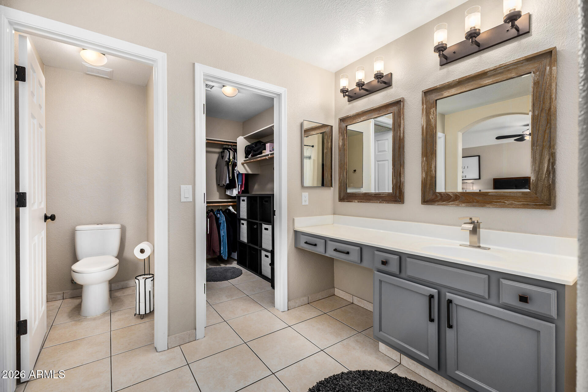 159 West Gail Drive Gilbert, AZ 85233 - Photo 32 of 46 a spacious bathroom with a toilet sink and mirror