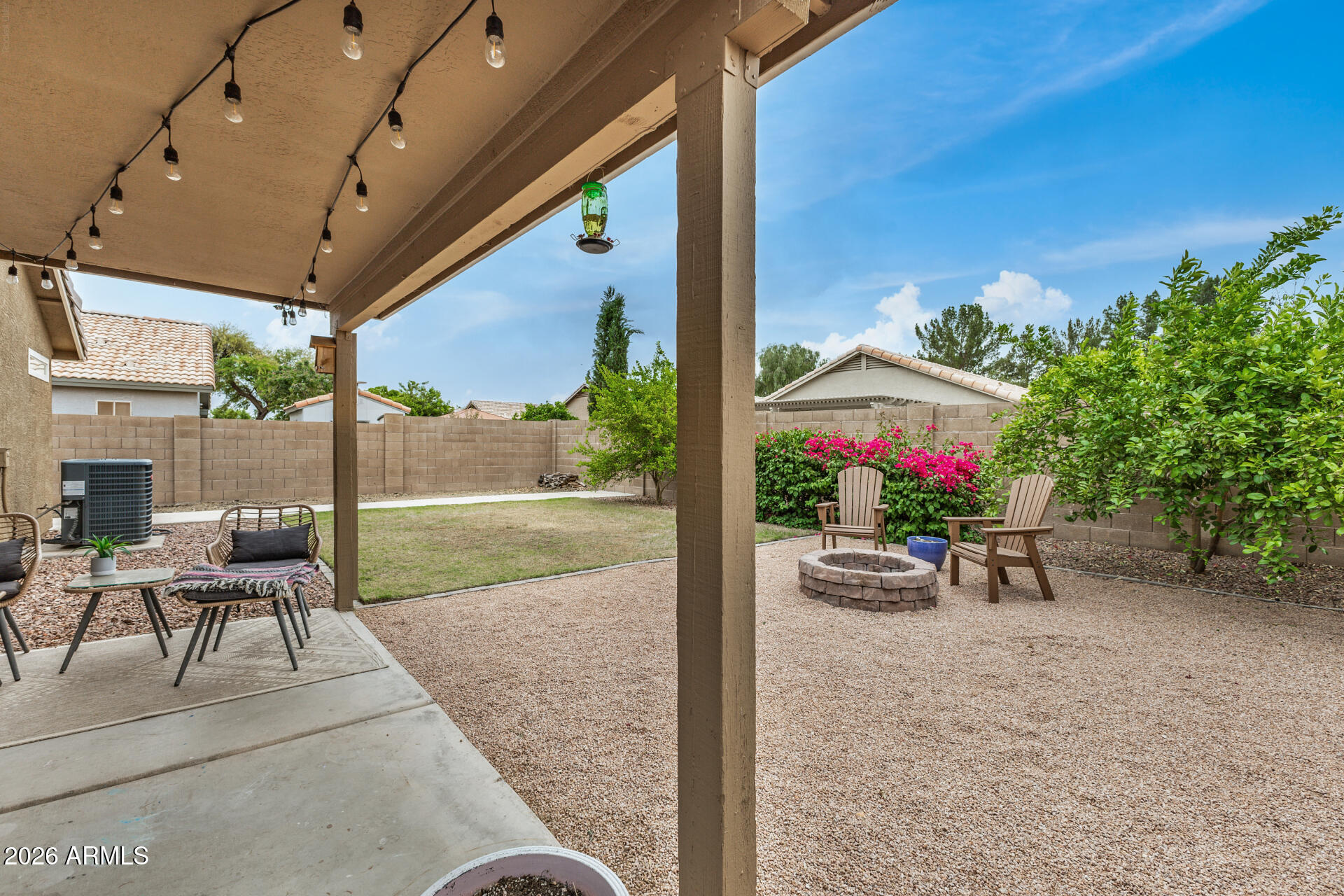 159 West Gail Drive Gilbert, AZ 85233 - Photo 42 of 46 a view of a patio with a table and chairs and potted plants