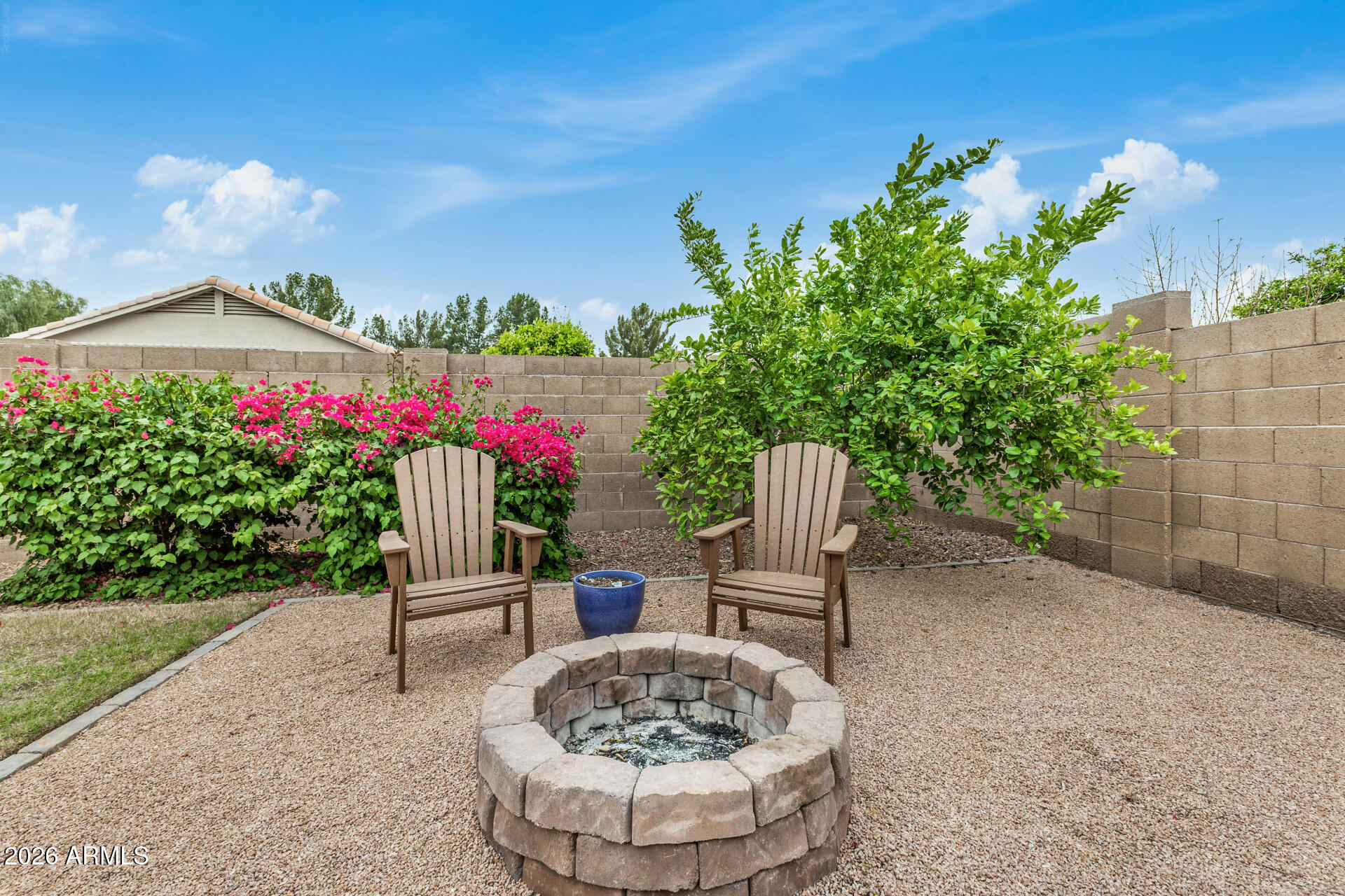 159 West Gail Drive Gilbert, AZ 85233 - Photo 45 of 46 a view of a chairs and table in the garden