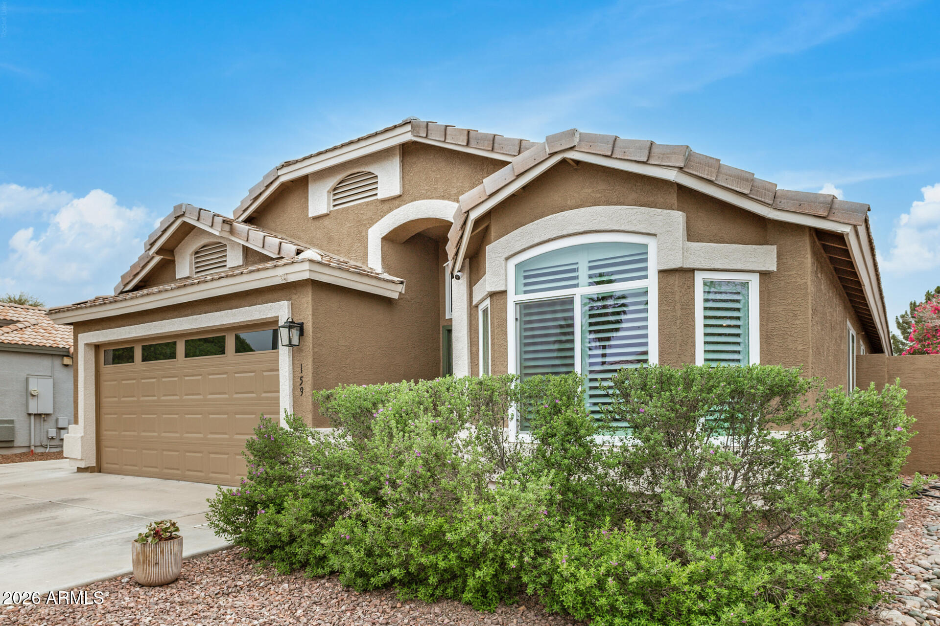 159 West Gail Drive Gilbert, AZ 85233 - Photo 6 of 46 a front view of a house with a yard