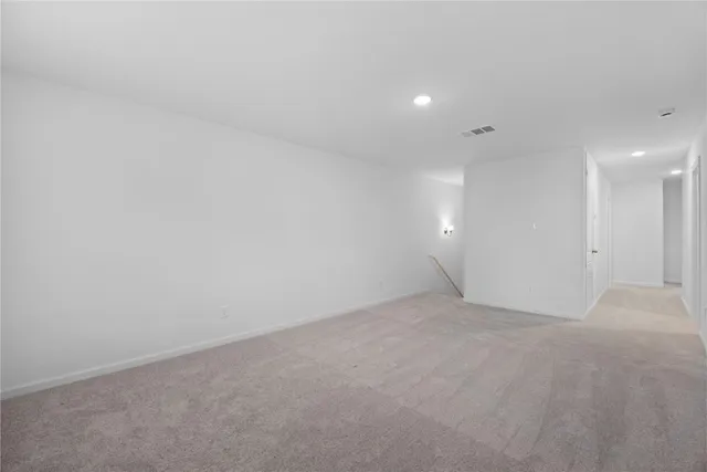 a kitchen that has a sink and a wooden floor