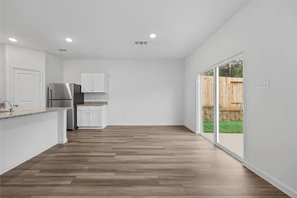 a view of kitchen with wooden floor
