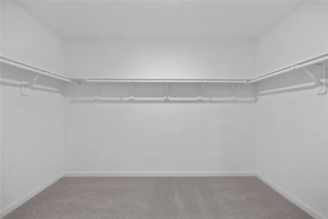 a view of an empty walk in closet