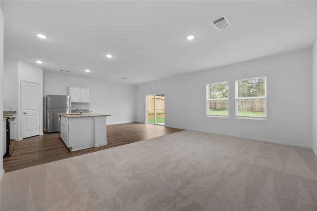 a view of kitchen and windows