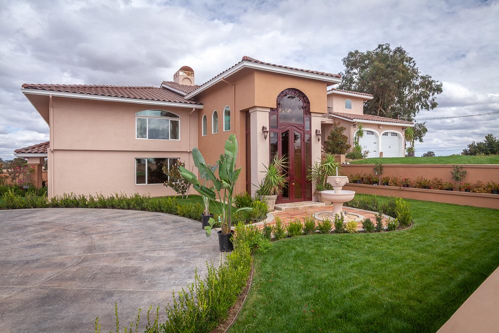 a front view of house with yard and green space
