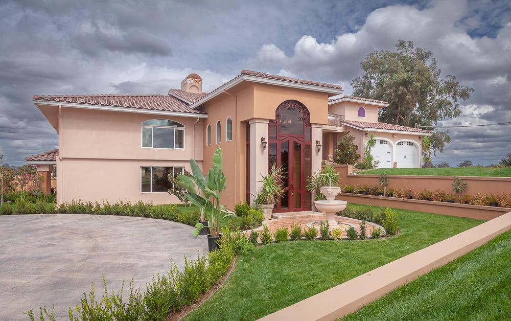 21190 East Acampo Road Clements, CA 95227 - Photo 2 of 89 a front view of a house with a yard