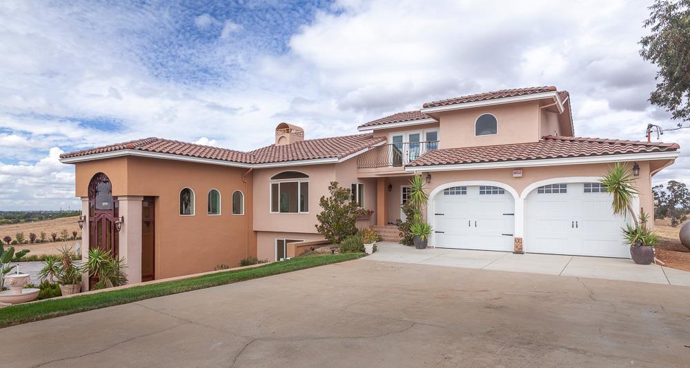 21190 East Acampo Road Clements, CA 95227 - Photo 4 of 89 a front view of a house with a yard