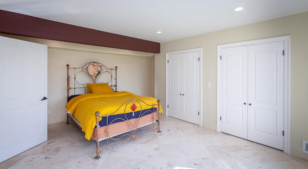 21190 East Acampo Road Clements, CA 95227 - Photo 50 of 89 a bed sitting in a room next to a cabinet