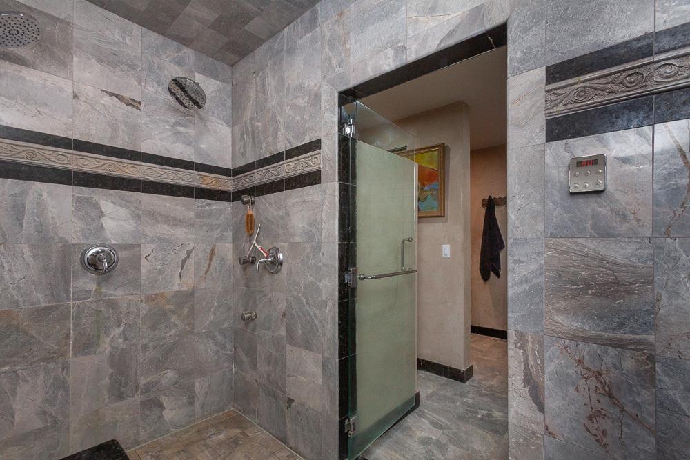 21190 East Acampo Road Clements, CA 95227 - Photo 55 of 89 a bathroom with a shower and a mirror