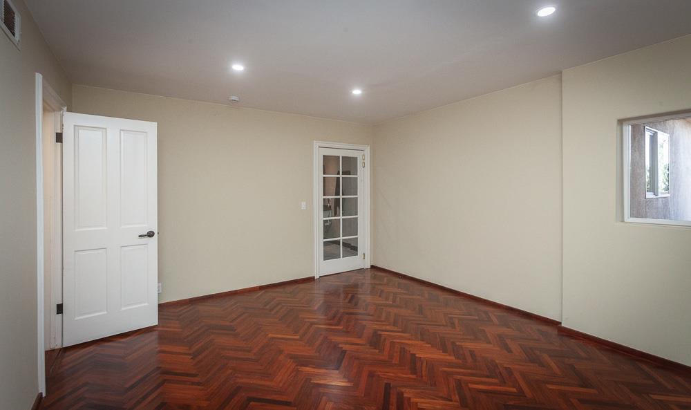 21190 East Acampo Road Clements, CA 95227 - Photo 57 of 89 a view of an empty room with wooden floor and a window