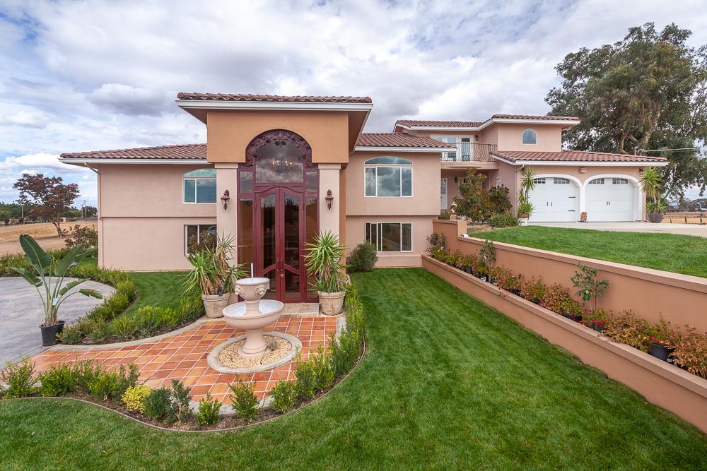 21190 East Acampo Road Clements, CA 95227 - Photo 6 of 89 a front view of a house with garden