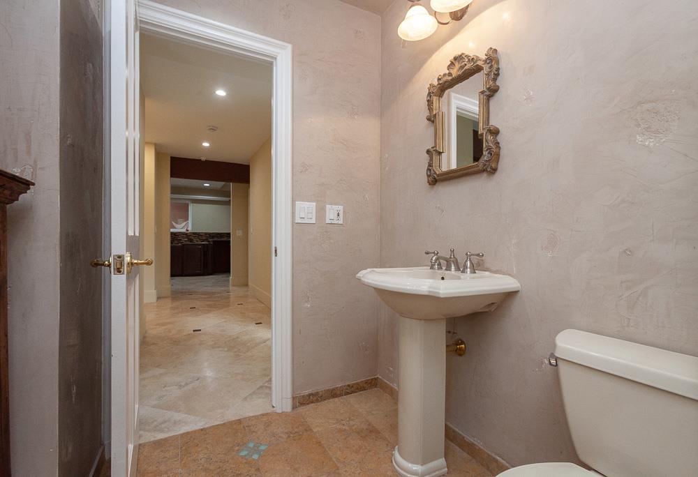 21190 East Acampo Road Clements, CA 95227 - Photo 61 of 89 a bathroom with a sink toilet and shower