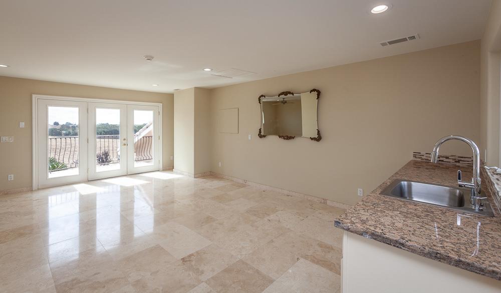 21190 East Acampo Road Clements, CA 95227 - Photo 62 of 89 a kitchen with a granite countertop sink and natural light