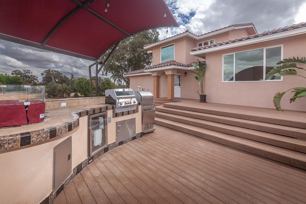 21190 East Acampo Road Clements, CA 95227 - Photo 78 of 89 a view of a white house with a sink and a stove