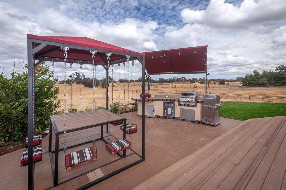 21190 East Acampo Road Clements, CA 95227 - Photo 82 of 89 a view of a chairs and table in the patio with a yard