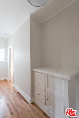 an empty room with wooden floor