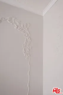 a wall with a white shower